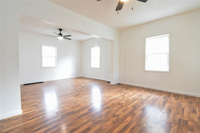 spare room featuring dark hardwood / wood-style floors and ceiling fan