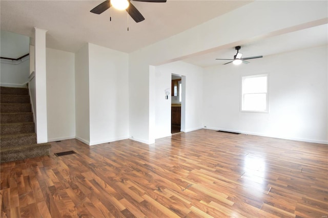 unfurnished room with hardwood / wood-style floors and ceiling fan