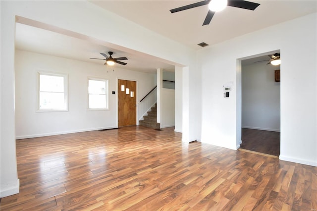 unfurnished room with dark wood-type flooring