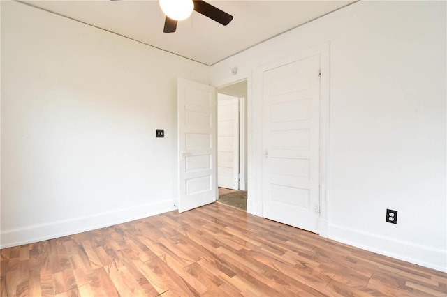 unfurnished room with hardwood / wood-style flooring and ceiling fan