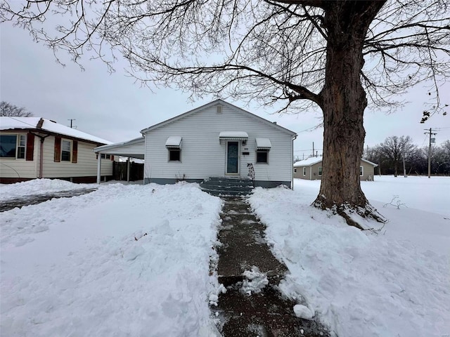 view of front facade with a carport