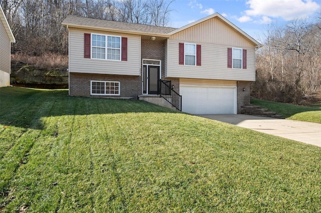 bi-level home with a garage and a front lawn