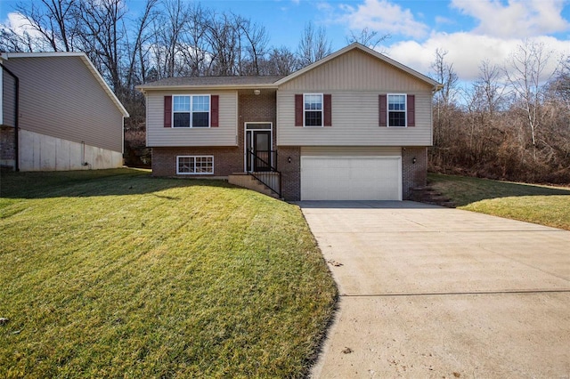 bi-level home with a garage and a front yard