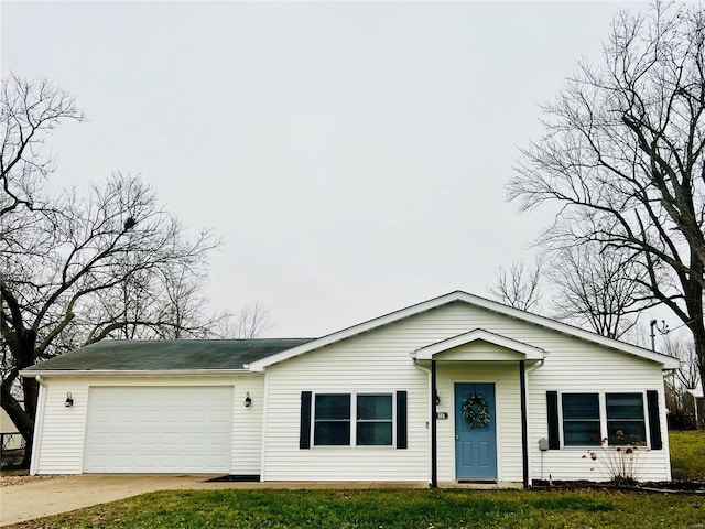 ranch-style home with a garage and a front lawn