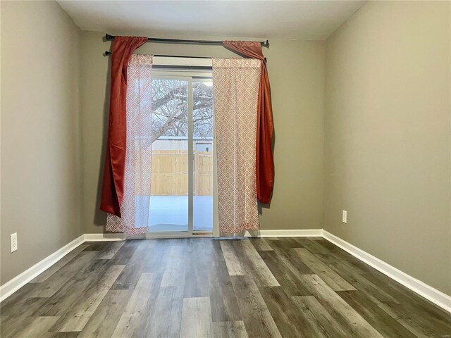 spare room with wood-type flooring