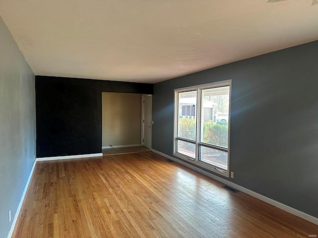 empty room with light wood-type flooring