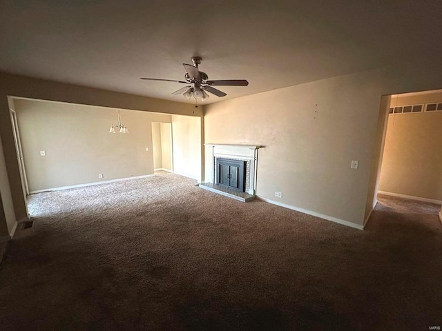 unfurnished living room with ceiling fan and carpet floors