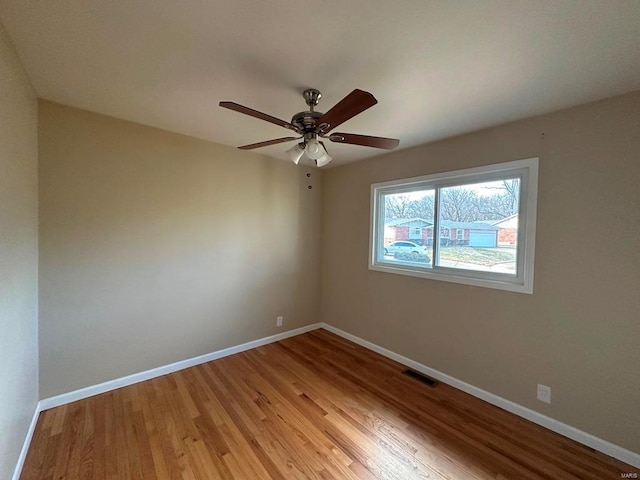 spare room featuring ceiling fan and light wood-type flooring