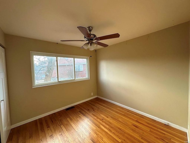 unfurnished bedroom with ceiling fan and light hardwood / wood-style flooring