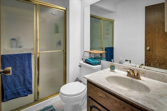 bathroom with tile patterned flooring, vanity, toilet, and an enclosed shower