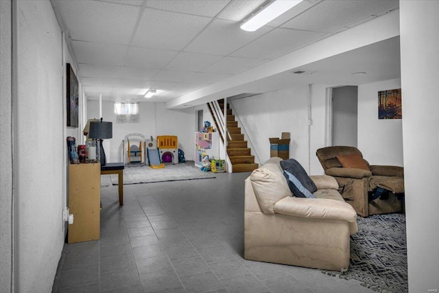 basement featuring a drop ceiling