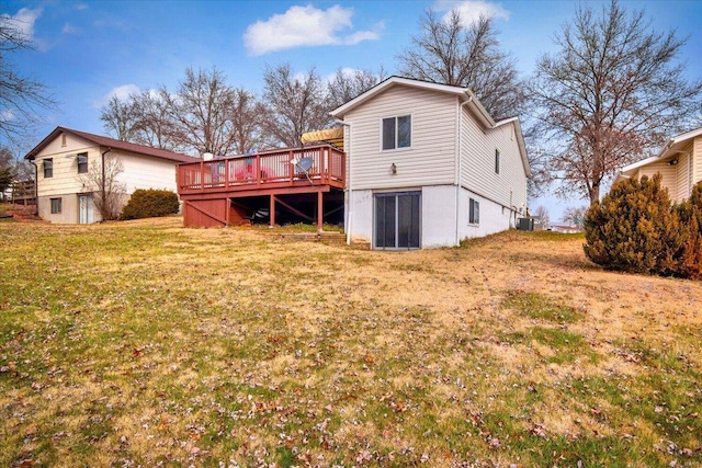 back of property featuring cooling unit, a deck, and a yard