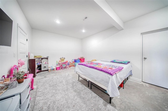 bedroom with beam ceiling and concrete flooring