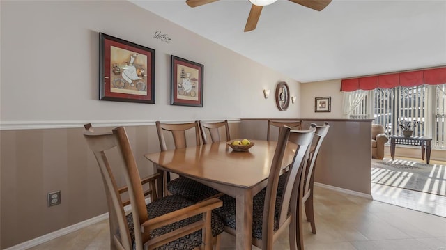 tiled dining area with ceiling fan