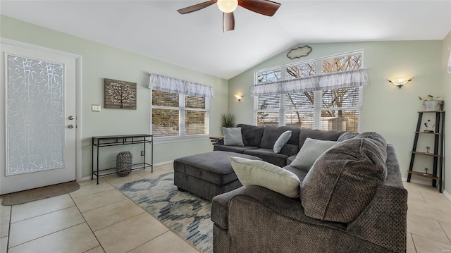 tiled living room featuring ceiling fan and lofted ceiling