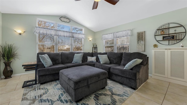 living room featuring vaulted ceiling, ceiling fan, and light tile patterned flooring