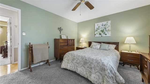 carpeted bedroom featuring ceiling fan