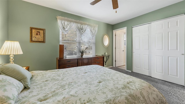 bedroom with dark carpet, a closet, and ceiling fan