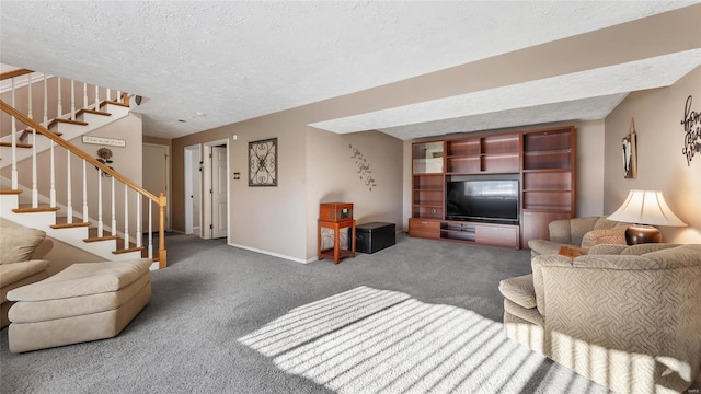 carpeted living room featuring a textured ceiling