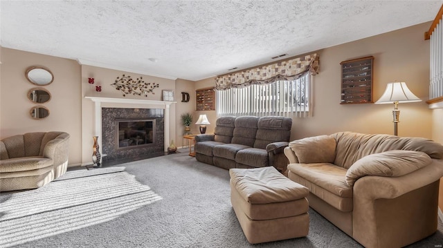 living room featuring a fireplace, carpet floors, and a textured ceiling