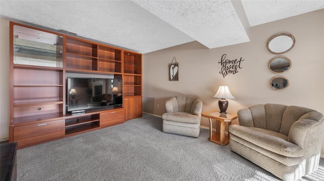 living room with carpet floors and a textured ceiling