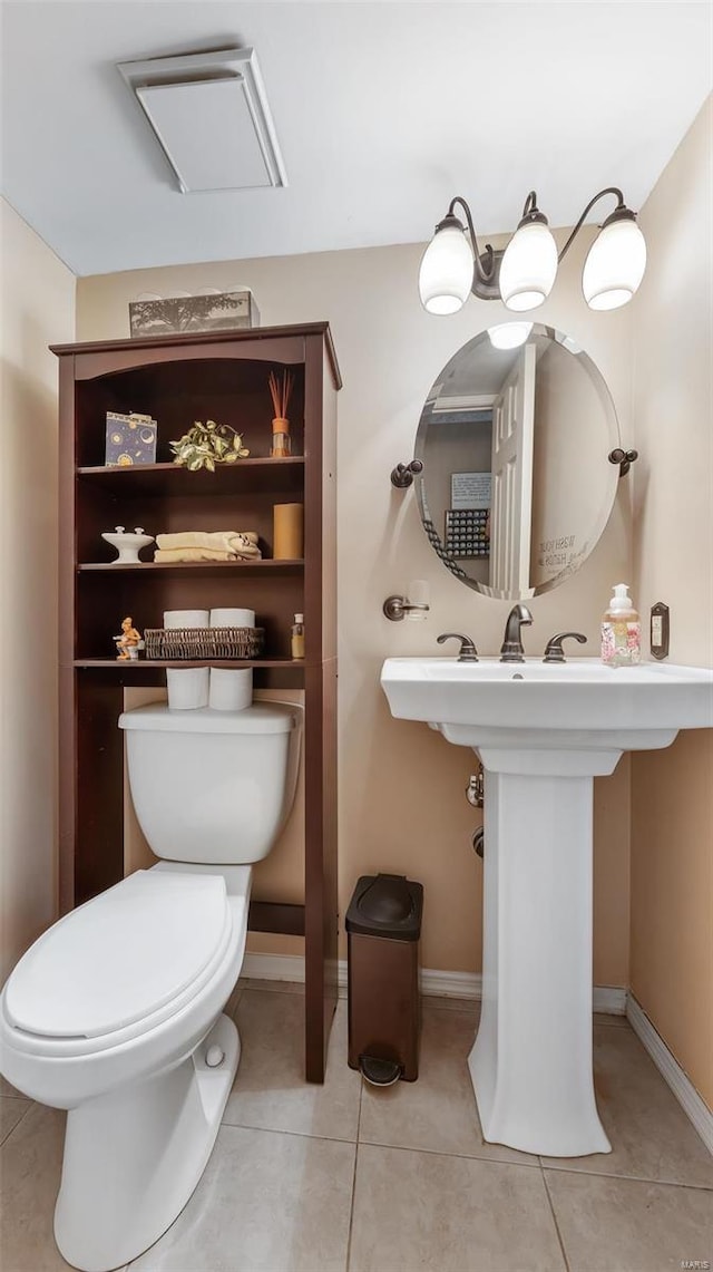 bathroom with tile patterned floors, sink, and toilet