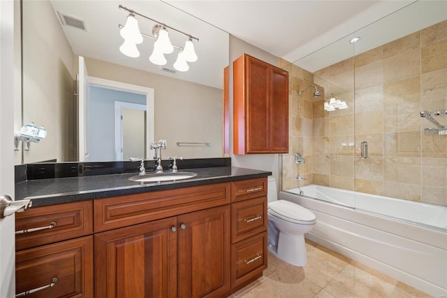 full bathroom with tile patterned floors, vanity, toilet, and combined bath / shower with glass door