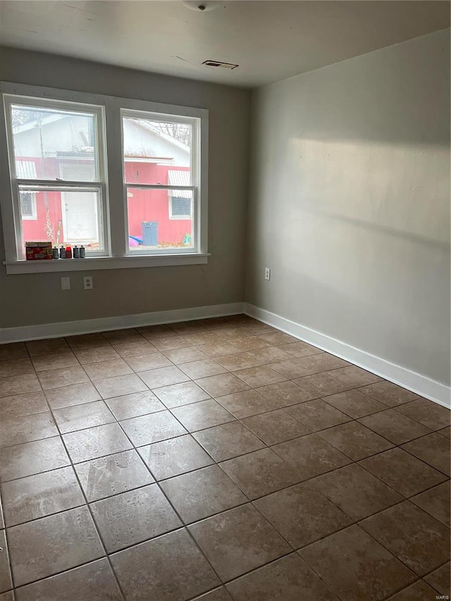 view of tiled spare room