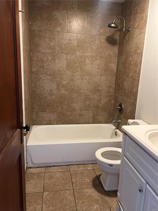 full bathroom featuring tile patterned floors, vanity, toilet, and tiled shower / bath