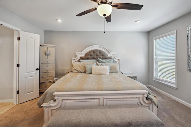 bedroom with recessed lighting, light colored carpet, ceiling fan, and baseboards