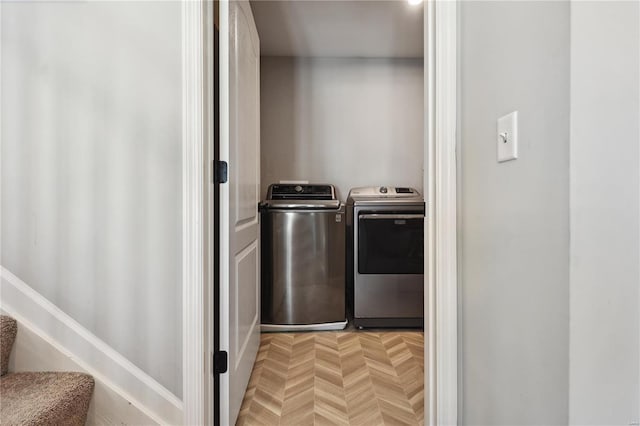 clothes washing area with laundry area and washing machine and clothes dryer