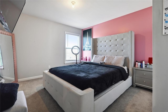 bedroom with carpet and baseboards