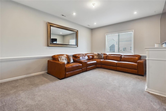 carpeted living room with recessed lighting, visible vents, and baseboards