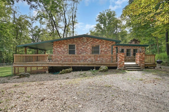 view of front of home featuring a wooden deck