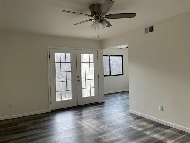 interior space featuring french doors, ceiling fan, and dark wood-type flooring