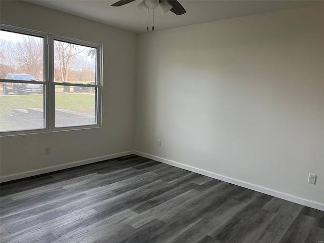 unfurnished room with ceiling fan and dark hardwood / wood-style floors