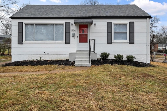 view of front of home with a front lawn