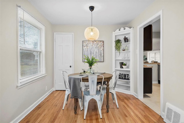 dining area with light hardwood / wood-style floors