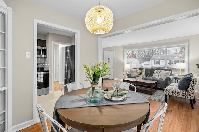 dining room featuring light hardwood / wood-style flooring