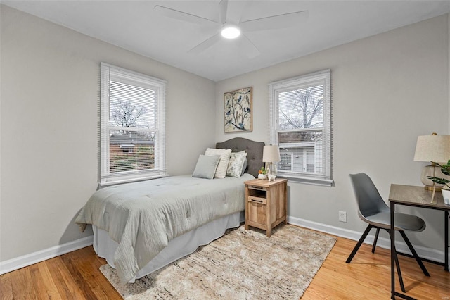 bedroom featuring ceiling fan and light hardwood / wood-style flooring