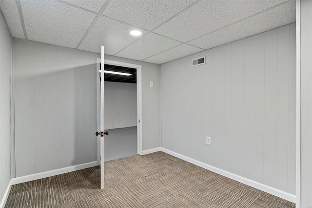 basement featuring a paneled ceiling