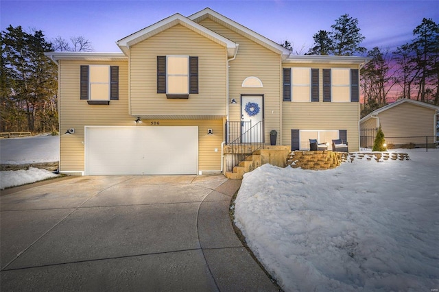 split foyer home featuring a garage