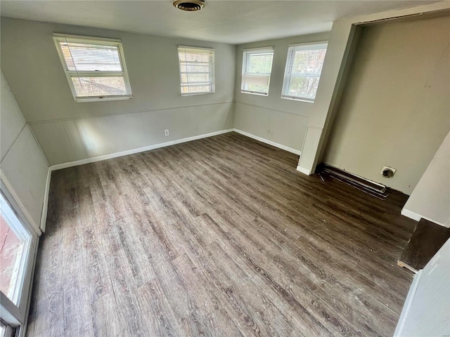 unfurnished bedroom with dark hardwood / wood-style floors