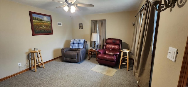 sitting room featuring ceiling fan and carpet floors