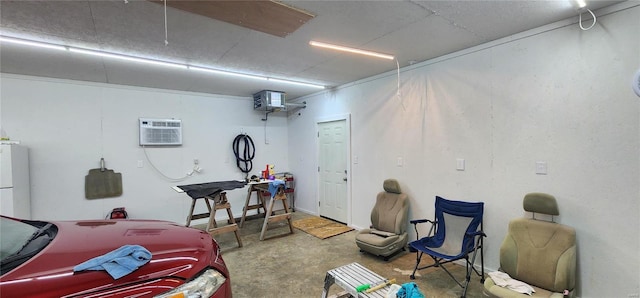 garage featuring a wall unit AC