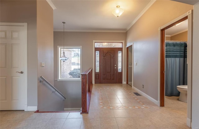 tiled entryway with crown molding