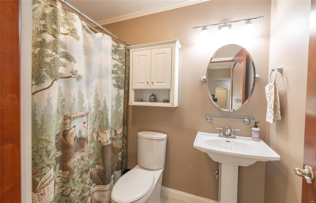 bathroom with toilet, curtained shower, and ornamental molding