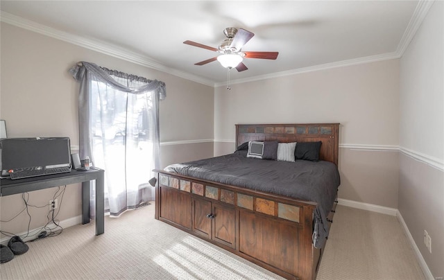 carpeted bedroom featuring ceiling fan and crown molding