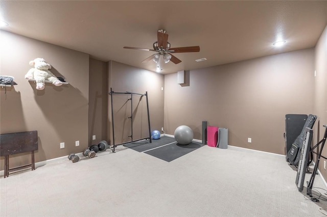 workout area featuring carpet floors and ceiling fan