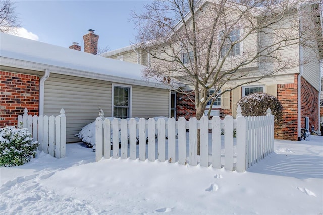 view of snow covered property